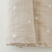 Little Unicorn Cotton Muslin Swaddle Blanket | Taupe Cross